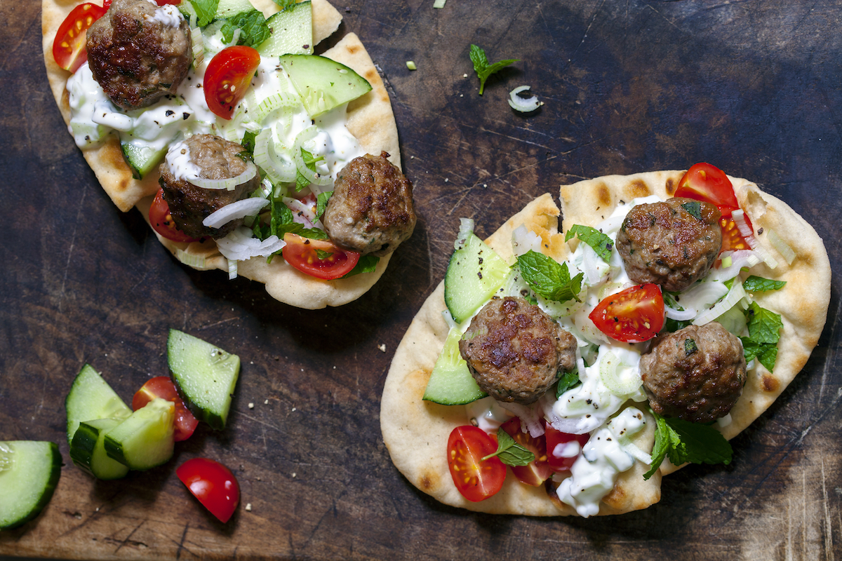 Flat,Breads,With,Lamb,Meatballs,,Yogurt,,Cucumber,And,Tomatoes