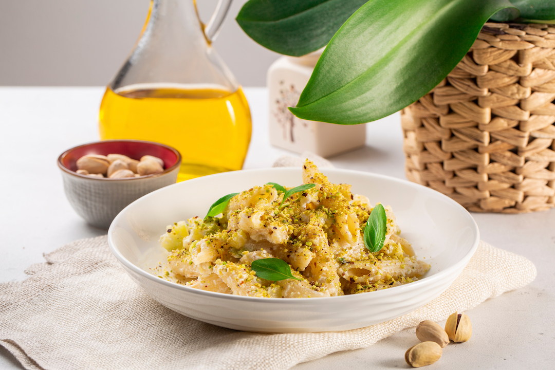 Italian,Pasta,With,Ricotta,Cheese,And,Pistachios,On,White,Table.
