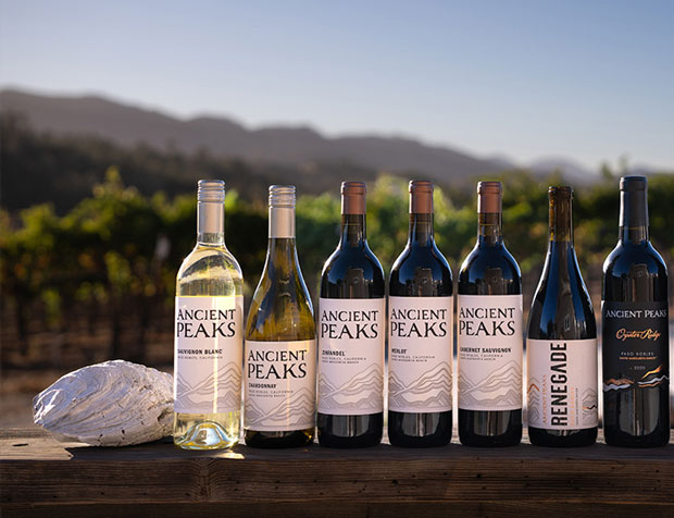 Ancient Peaks wine bottles with vineyard in background